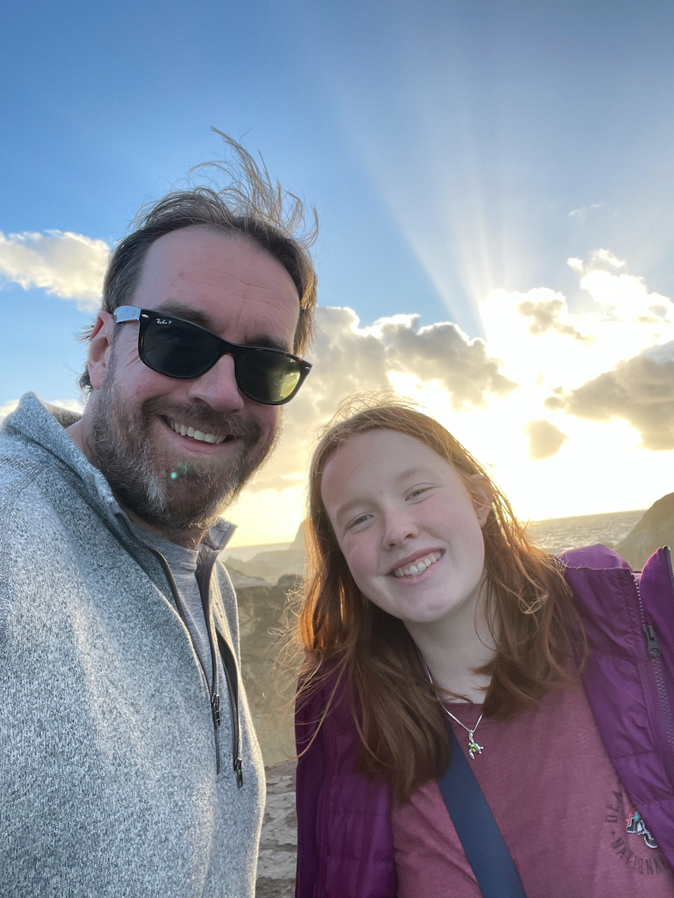 Cameron and myself pose for a photo on top of the Cape Kiwanda Sand Dunes with a stunning sunset taking place behind us.