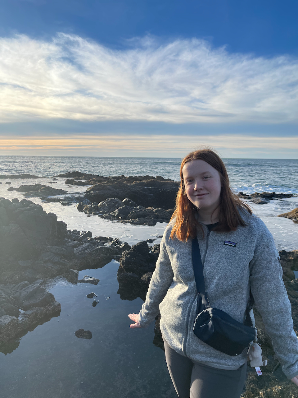 Cameron standing in the brief moment of clam in tidal pools of Thors Well.   