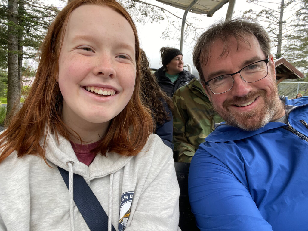 Cameron and myself sitting on the dog sled and going for a ride with huge smiles at the Turning Heads Kennel outside of Seward Alaska. 