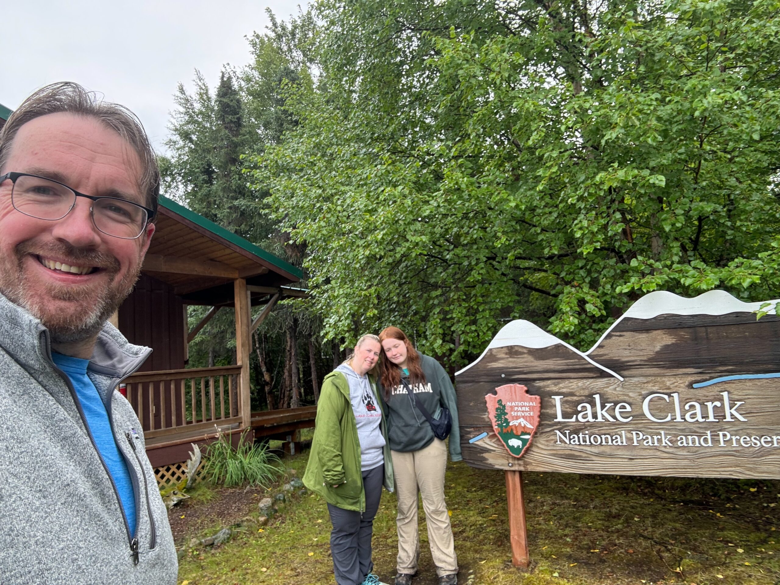 Cat, Cameron and myself standing in front of the Lake Clark Part sign.