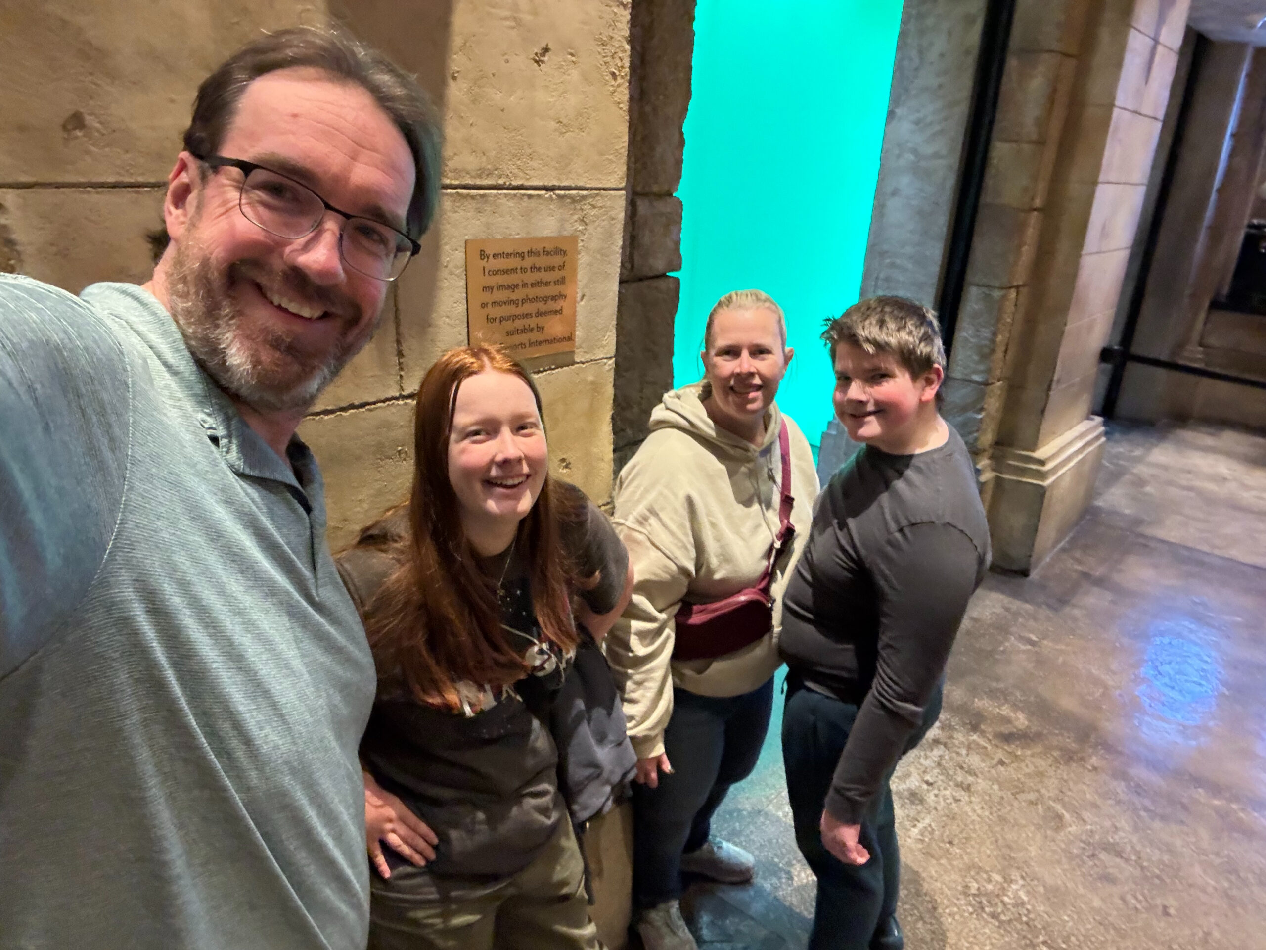 Chris, Cami, Collin and Cat standing in the lobby of the Shark Reef Aquarium.