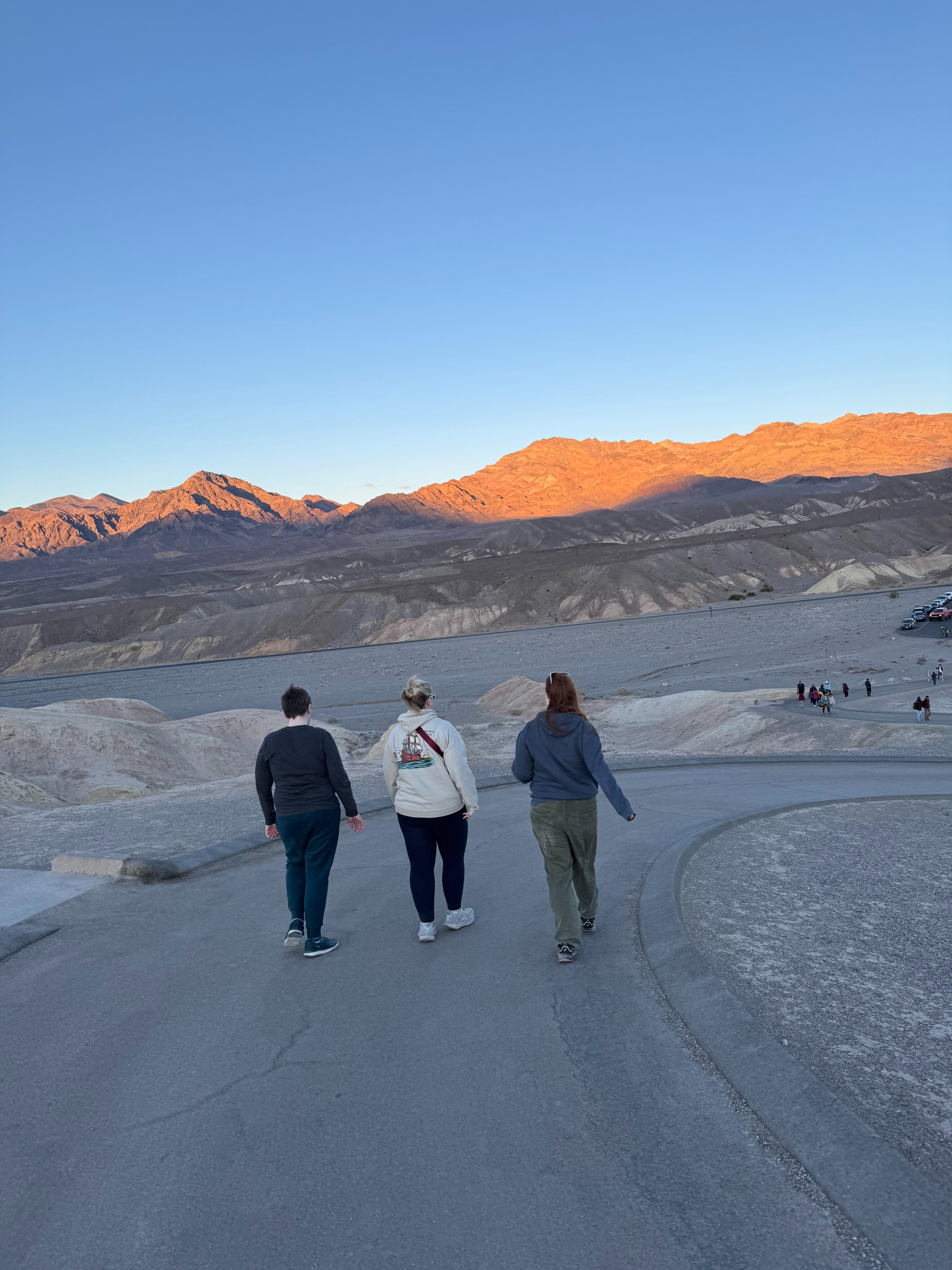 Cat, Collin and Cameron walking down the trail from the overlook at Zabriskie Point.