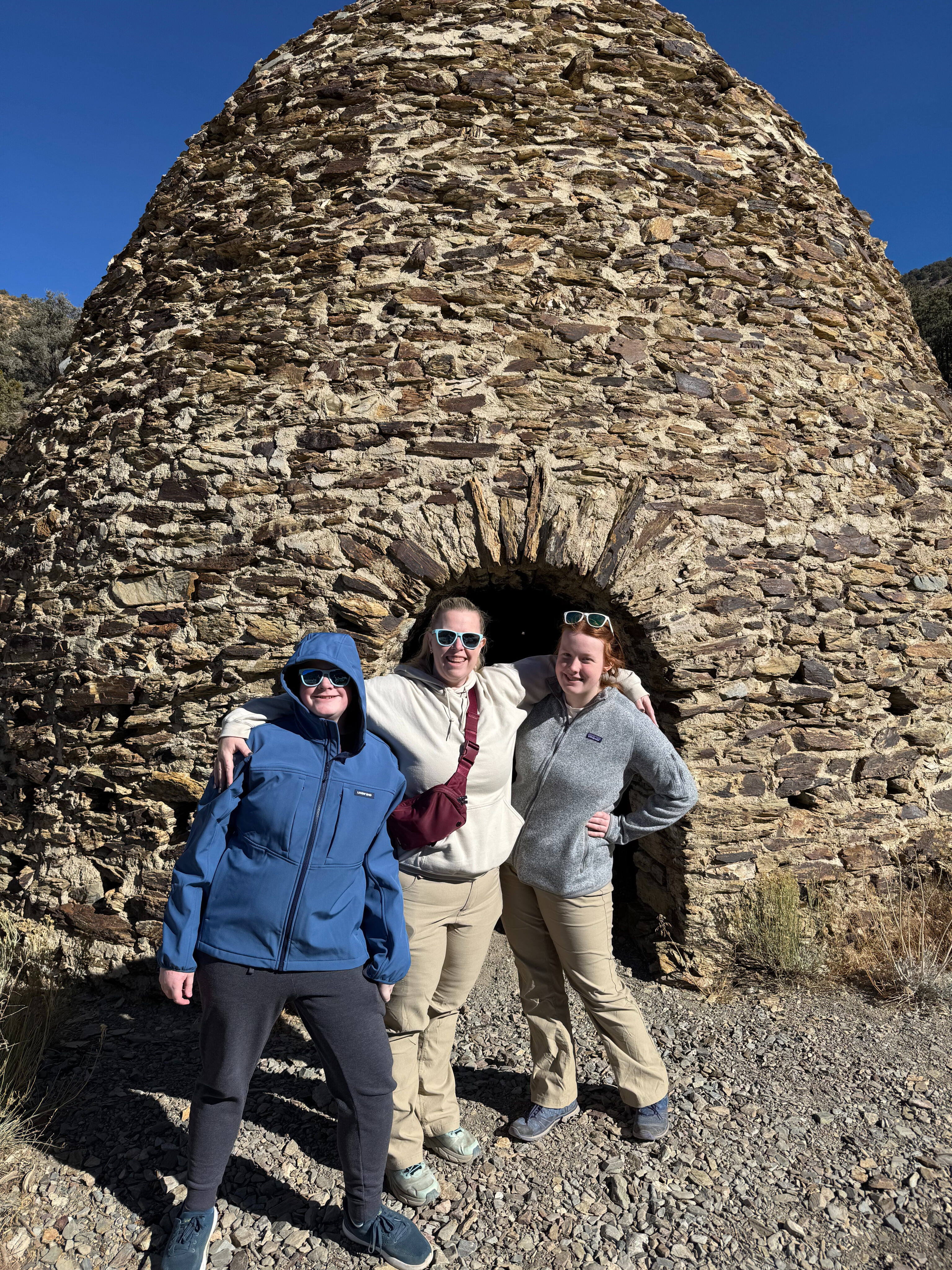 Cat, Cameron and Collin standing in front of one of the Wildrose Charcoal Kilns in Death Valley National Park.