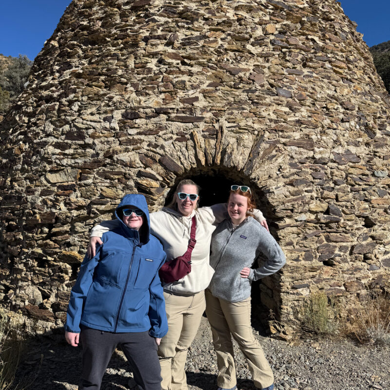 Cat, Cameron and Collin standing in front of one of the Wildrose Charcoal Kilns in Death Valley National Park.