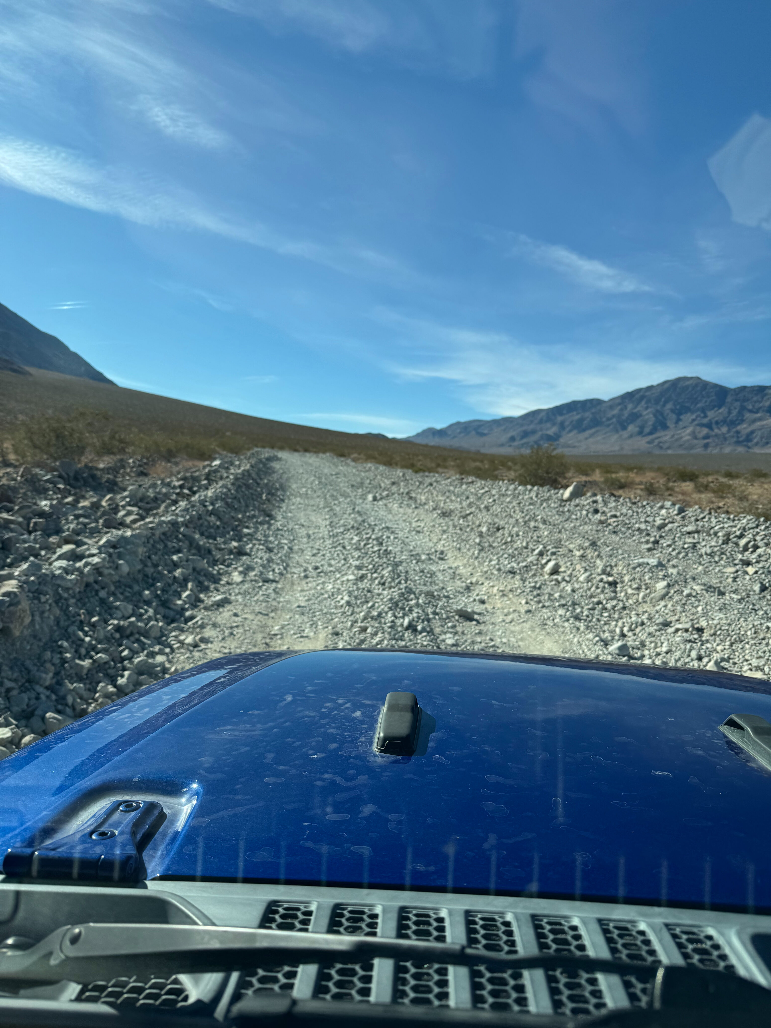 View of the dirt road in Death Valley that brings you to the Racetrack. View from the windshield. 