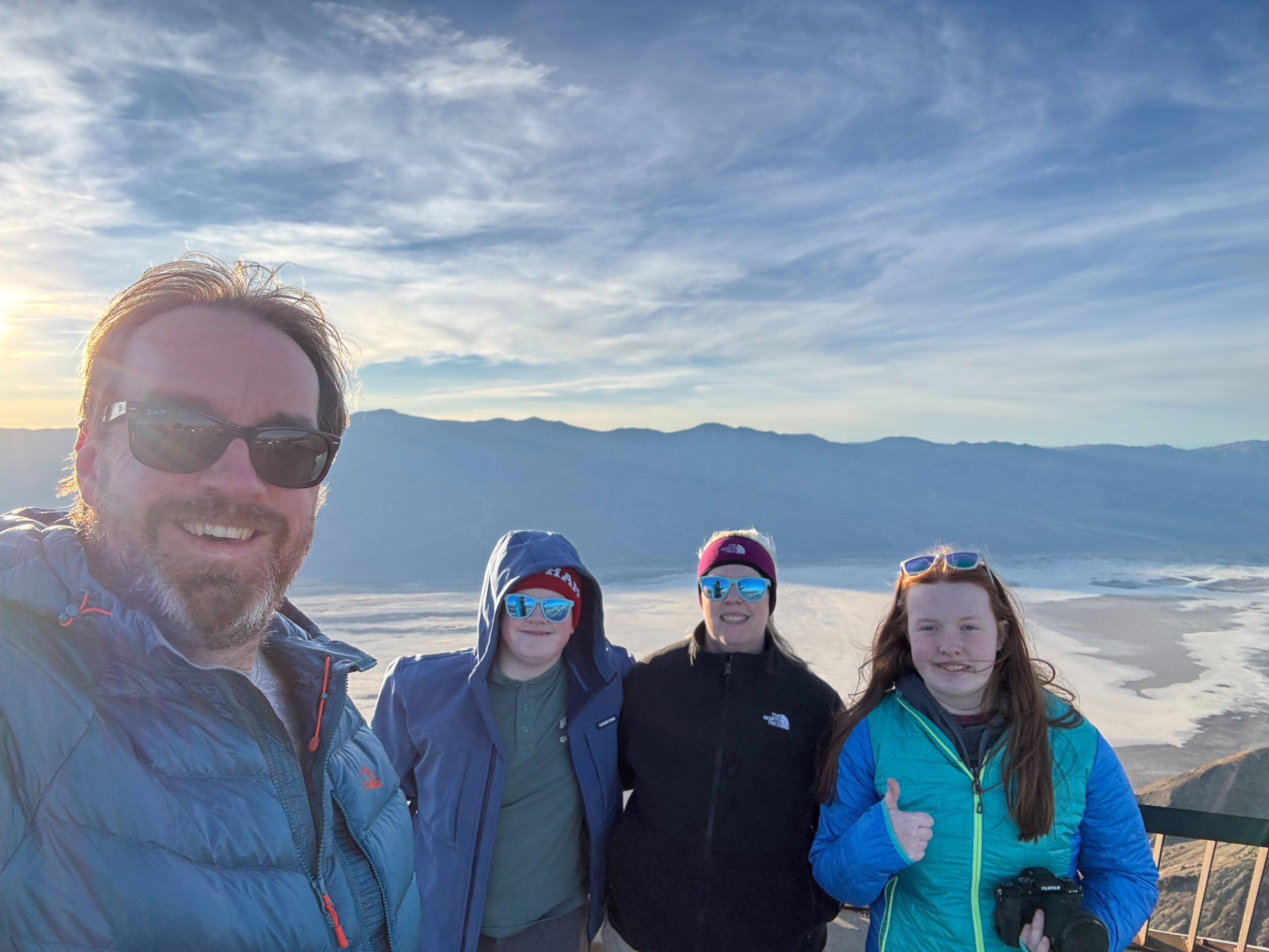 Chris, Cat, Collin and Cami standing in the freezing cold at Dante's View - with the valley behind us. 