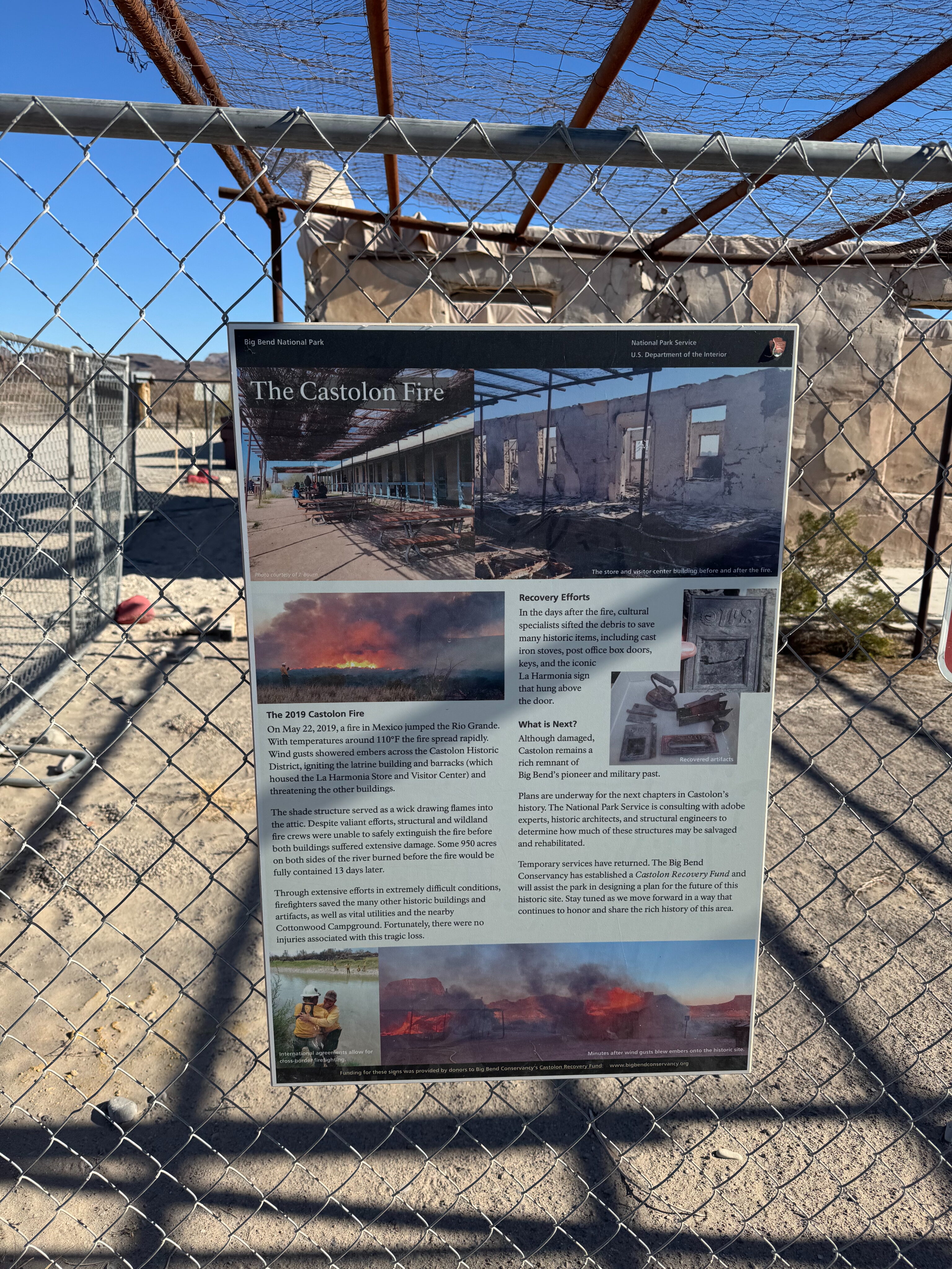 A sign showing the fire damage on the Ross Maxwell Dr. 