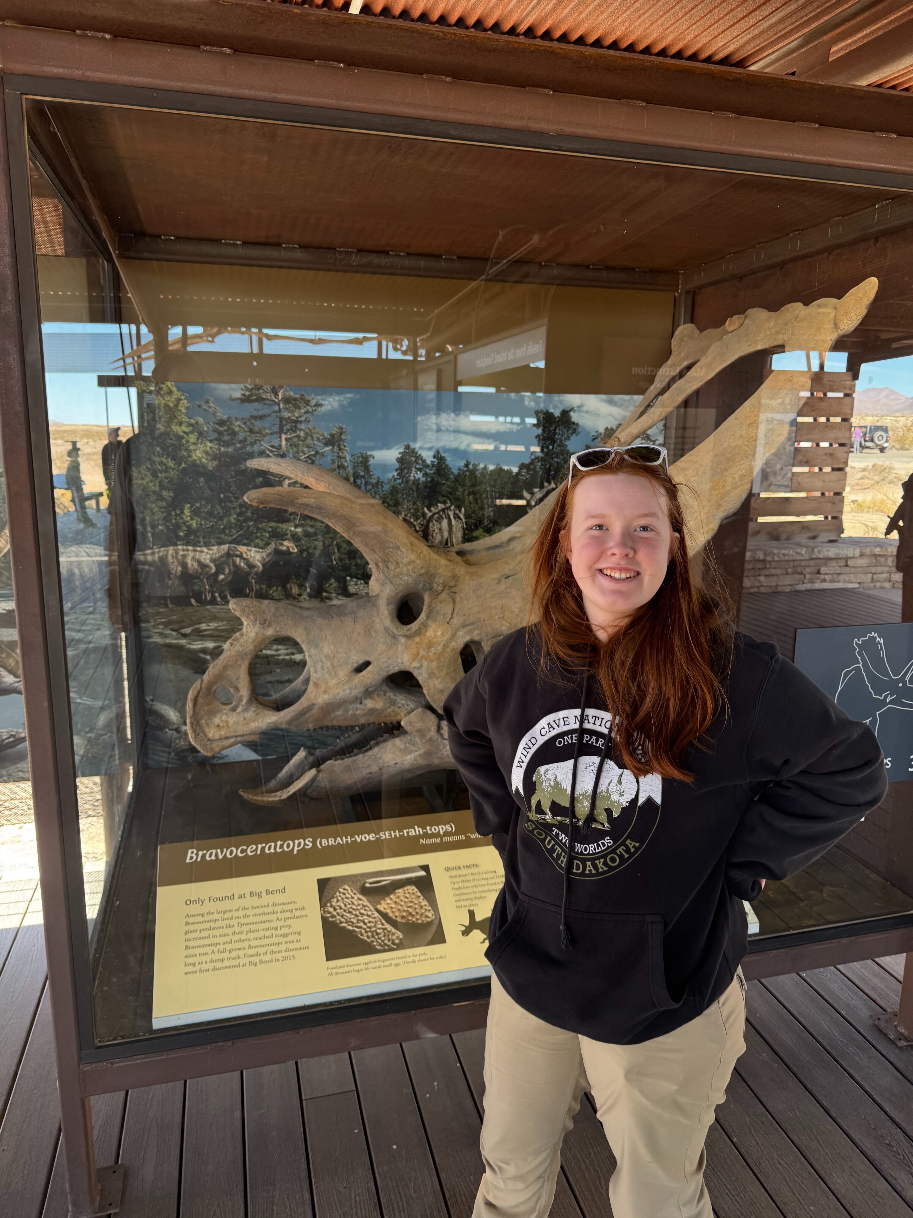 Cameron standing and smiles at the Fossil Discovery Exhibit in Big Bend.