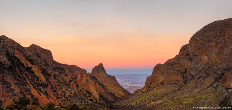 Sunrise panorama of The Window in Big Bend National Park, showcasing the natural rock formation and the colorful sky at the end of blue hour.