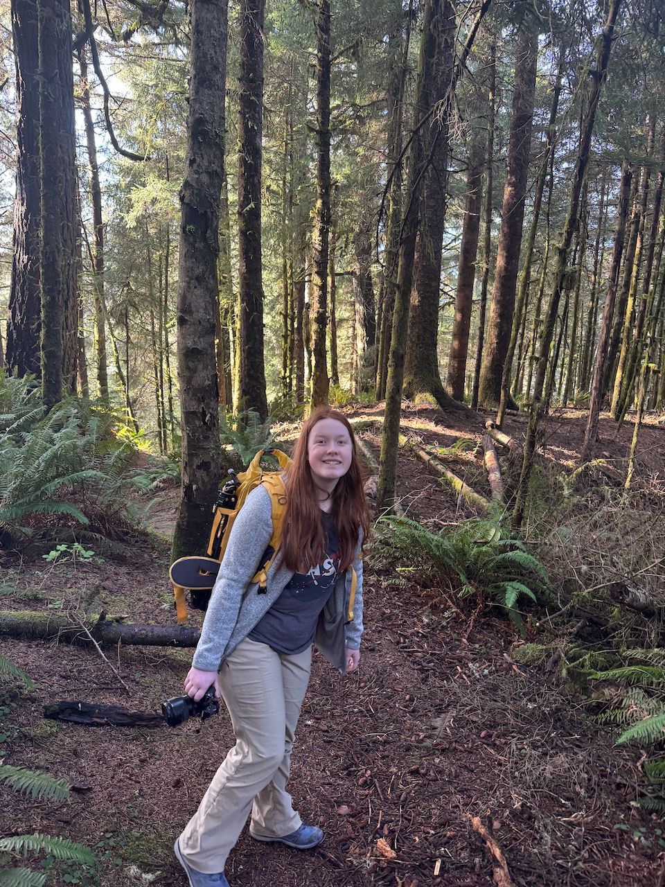 Cameron all smiles as we walk through the forest on the Thunder Rock Cove Trail with light spilling through the forest.