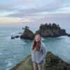 Cameron at sunset with clouds in the sky and a few islands right behind her at the Thunder Rock View Point.