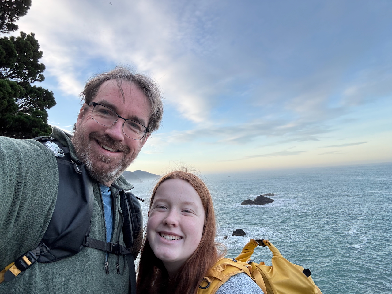 Cameron and myself pose for a picture, both with our large camera bags on at the Thunder Rock Cove Viewpoint.