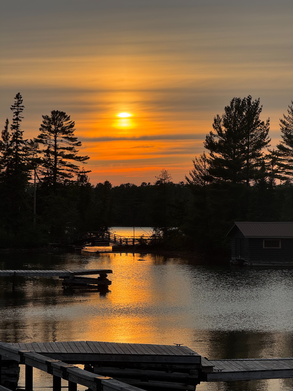 The bay at sunset with clouds in the sky at Cooper Harbor MI.