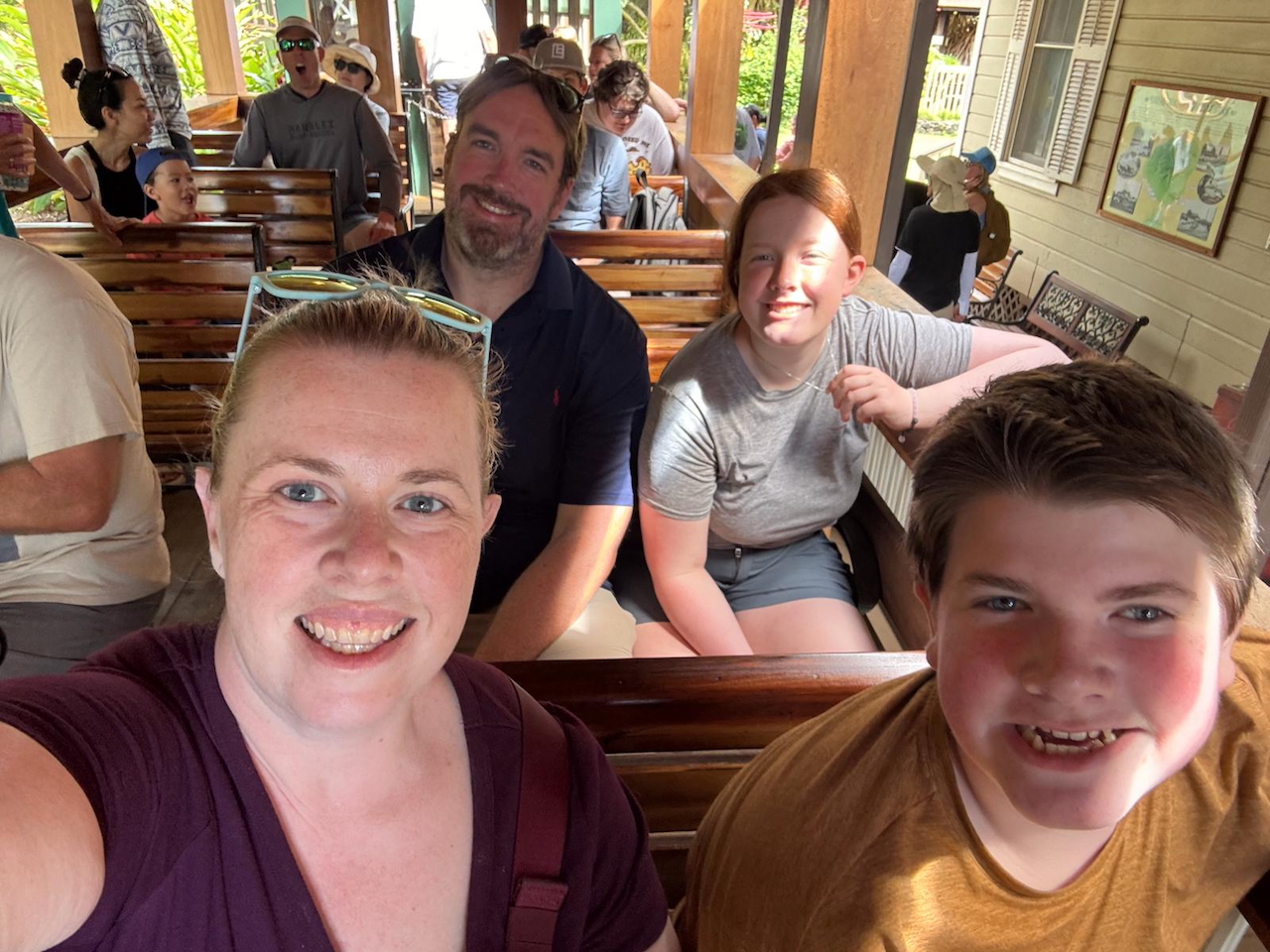 Family riding the open-air Kauaʻi Plantation Railway train.