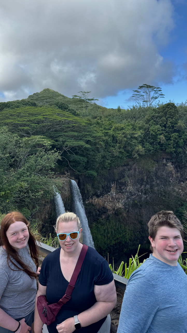 Cat, Collin, and Cameron in front of Wailua Falls in Kauaʻi.