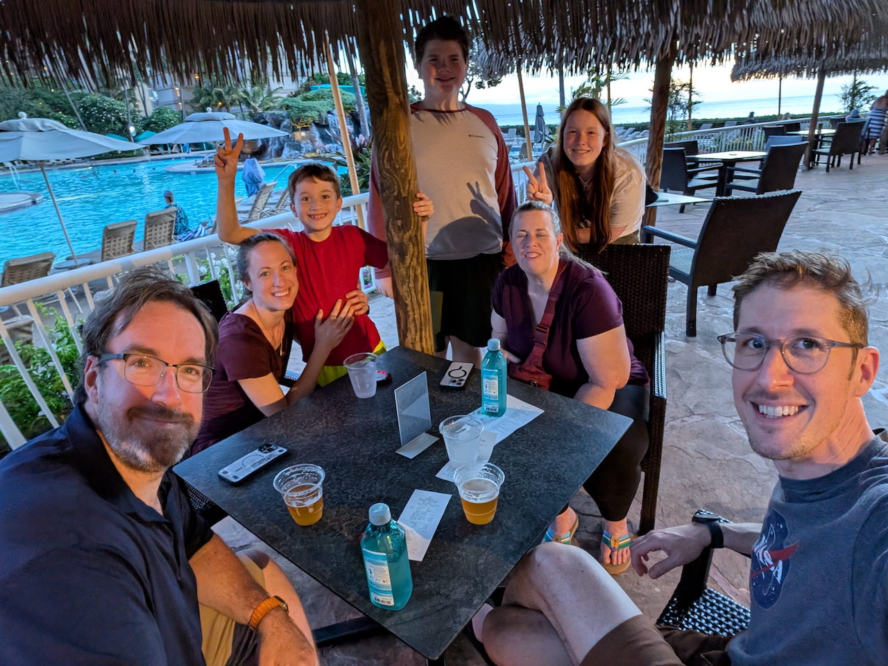Family group at outdoor restaurant in Maui.