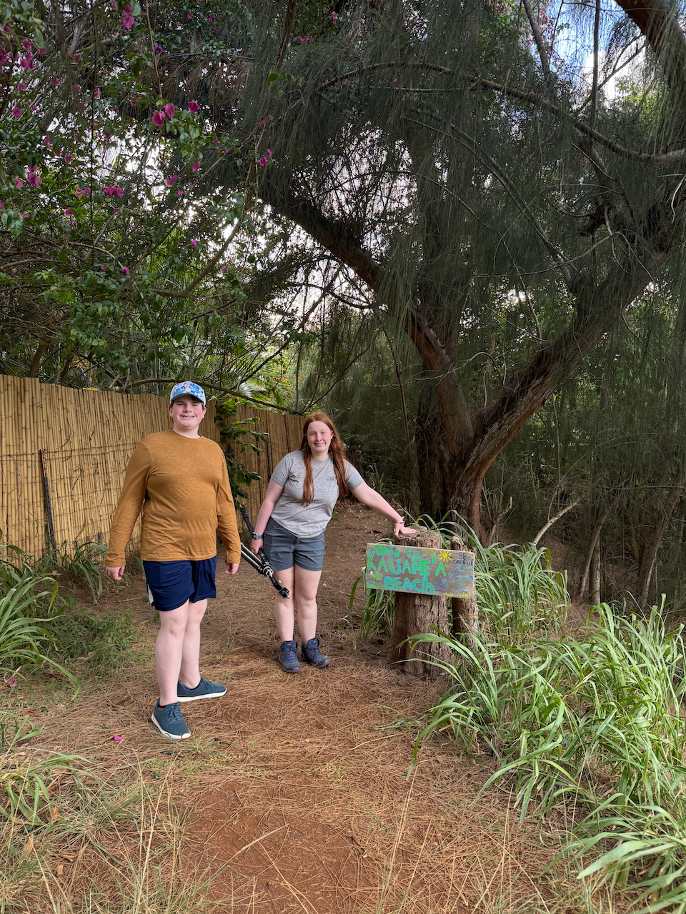 Collin and Cameron on the wooded trail leading down to Secret Beach in Kauaʻi.