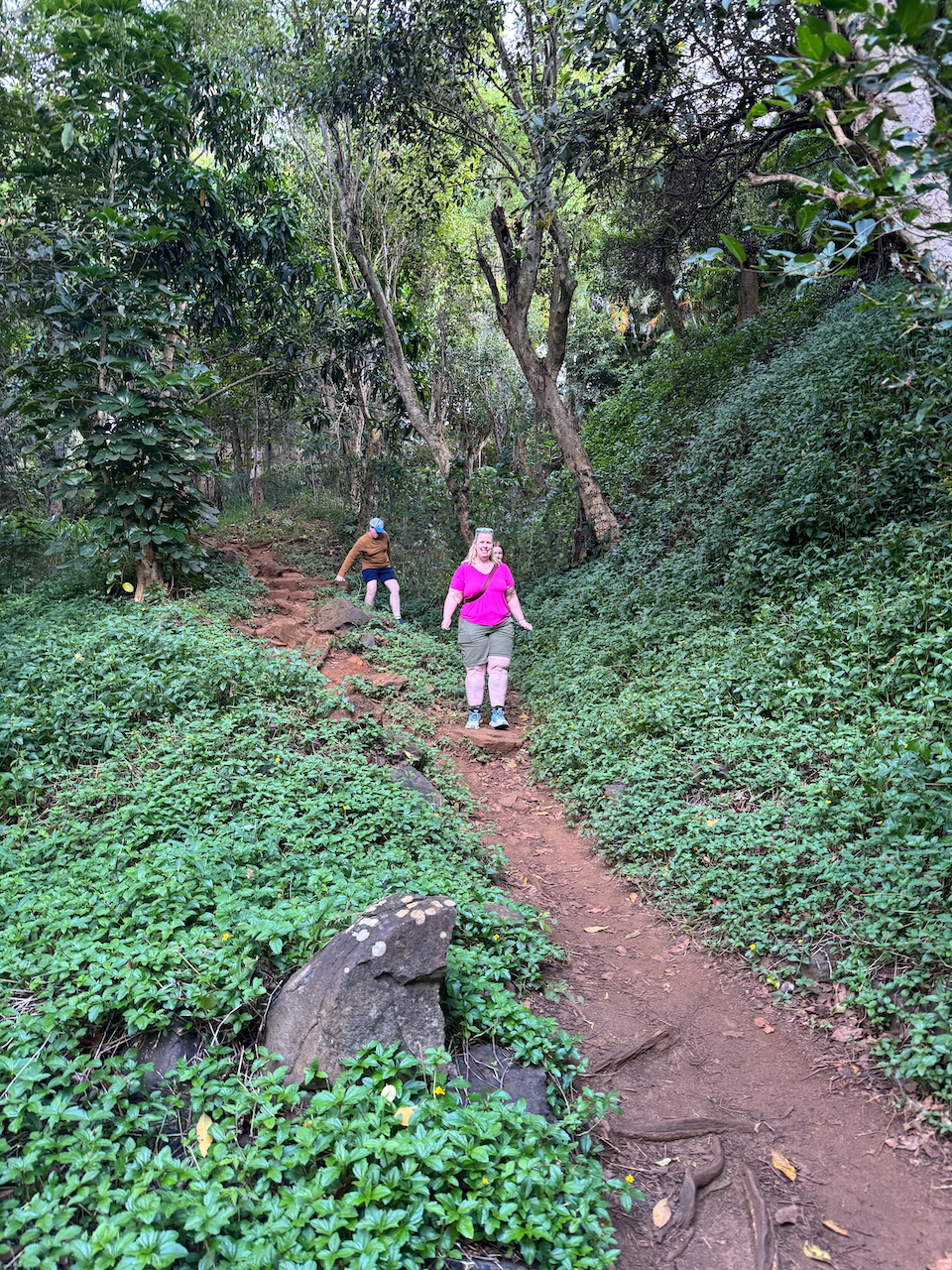 Cat, Collin, and Cameron hiking the steep trail to Secret Beach.