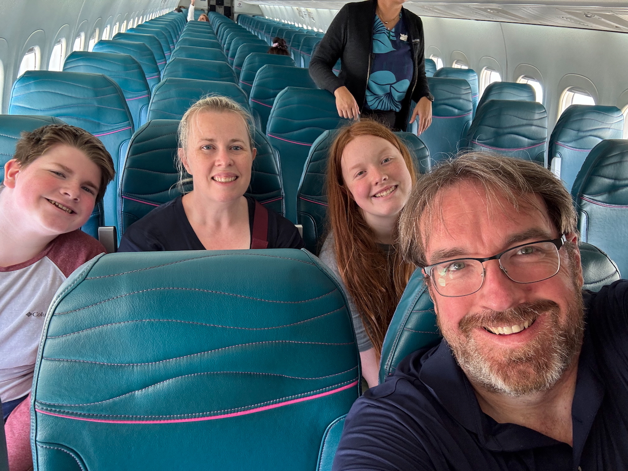 Family trip to Hawaii 2025 selfie on the flight from Kauaʻi to Honolulu.