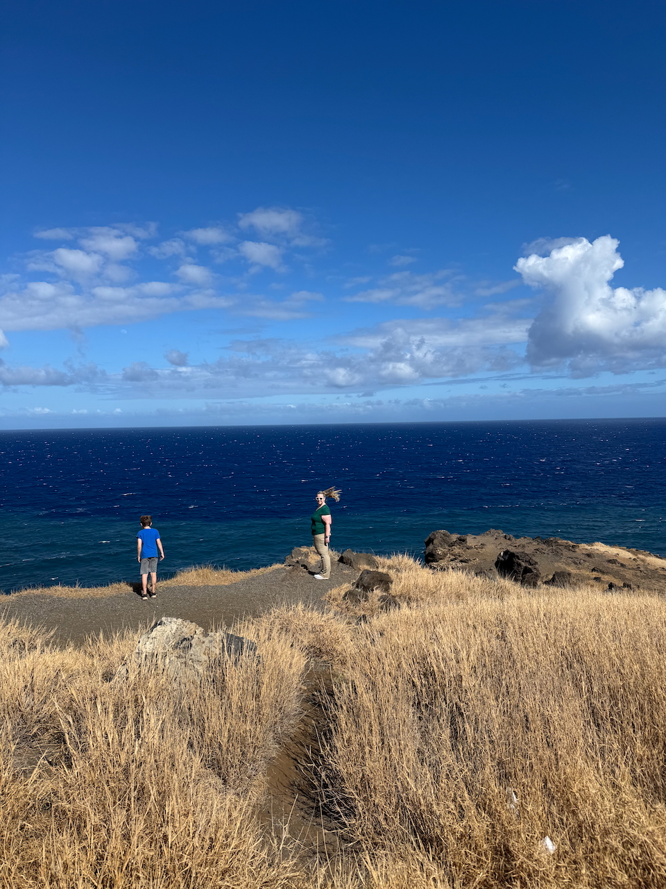 Cat and Nate on cliffs by the ocean.
