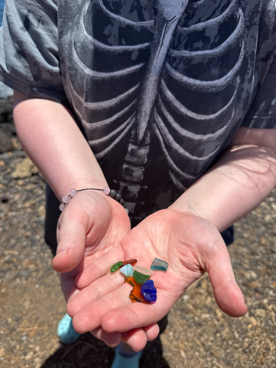 Cameron holding sea glass.