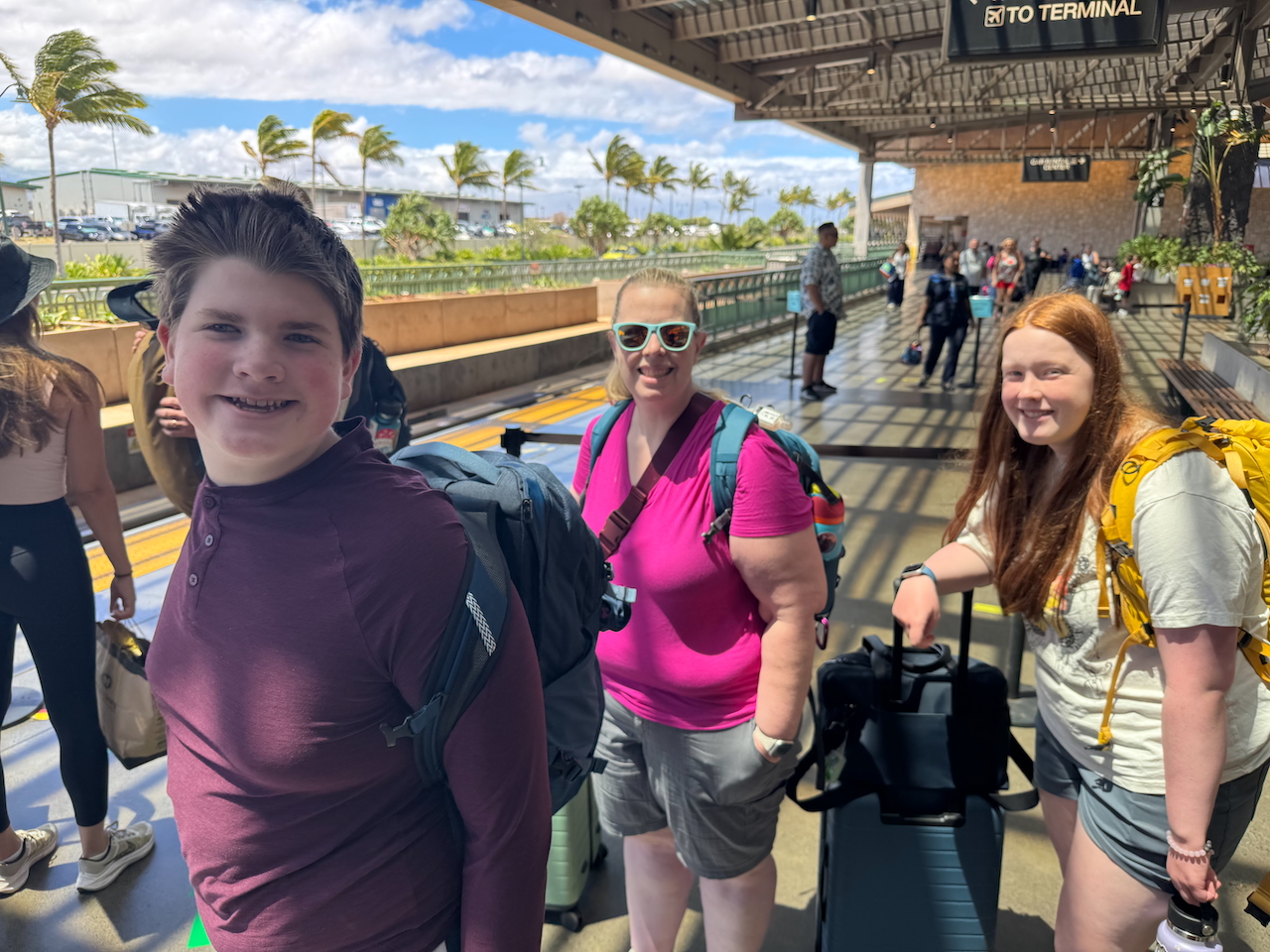 Collin, Cameron, and Cat at the airport.