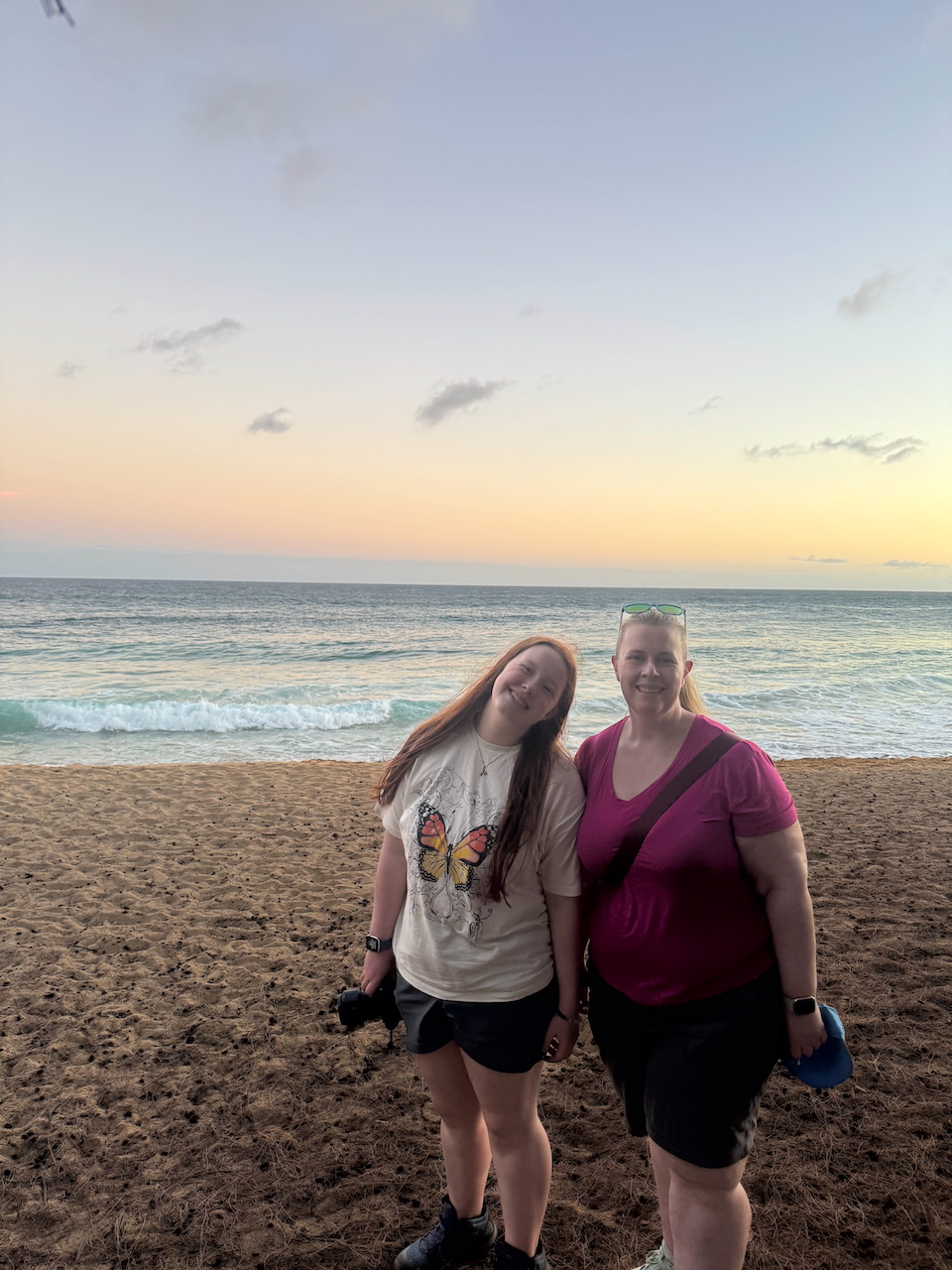 Cat and Cameron at sunset on Kauai beach.