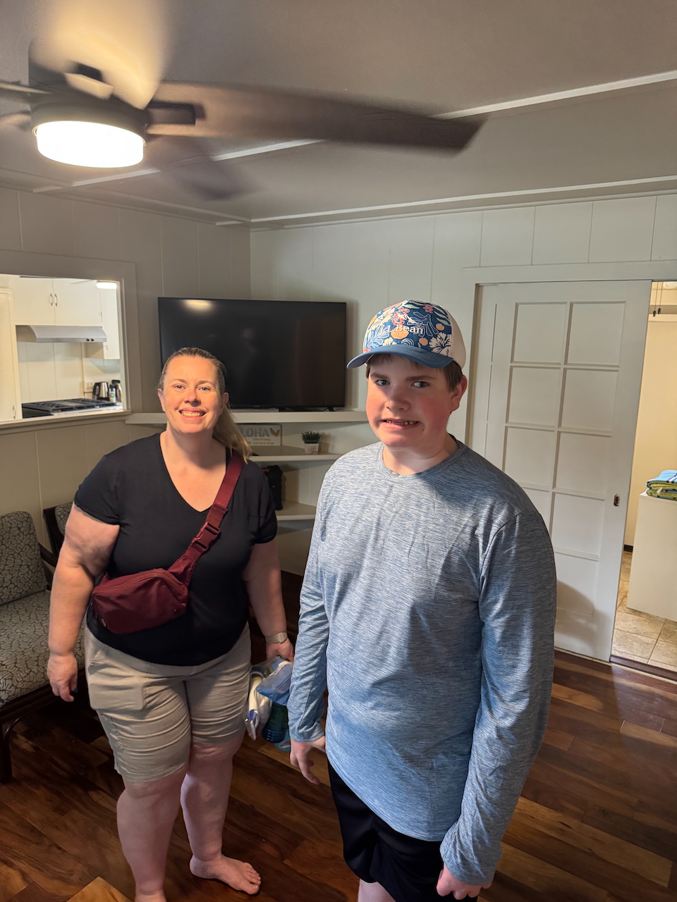 Cat and Collin standing inside the Airbnb rental in Kauaʻi.
