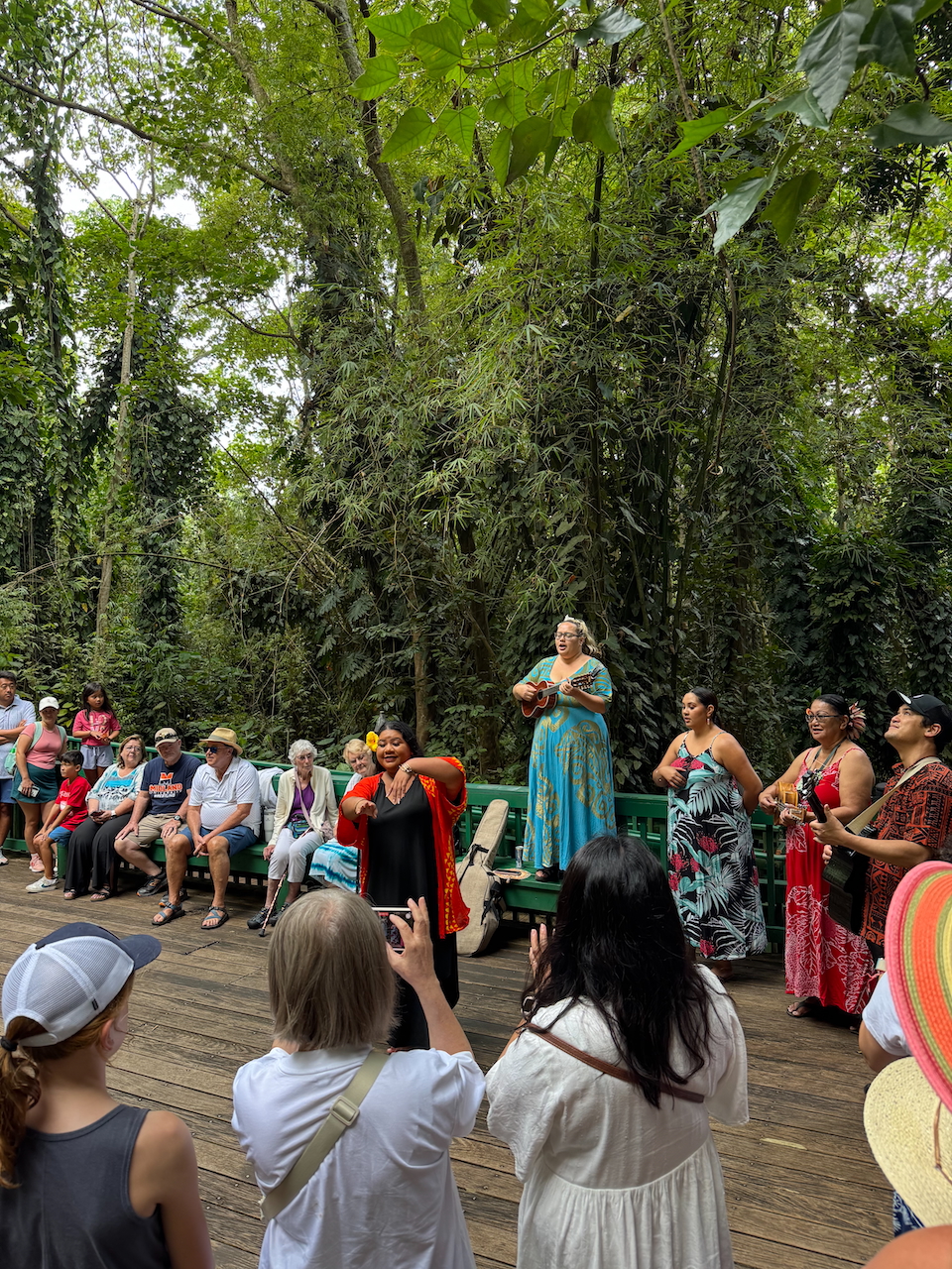 our group watching a cultural performance at the Fern Grotto in Kauaʻi.