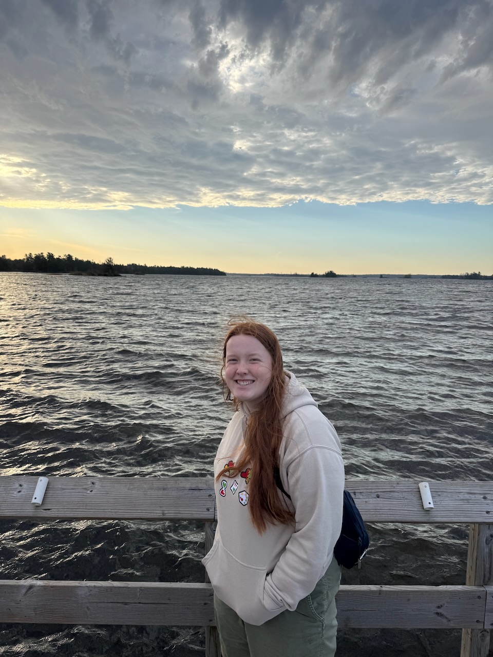 Cameron standing by Rainy Lake at sunrise in Voyageurs National Park.