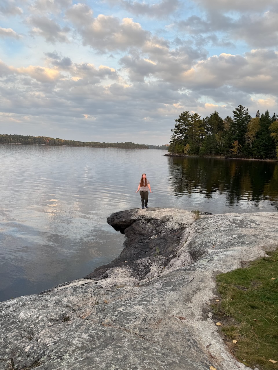Cameron standing by the lake at the Ash River area in Voyageurs National Park at dusk.