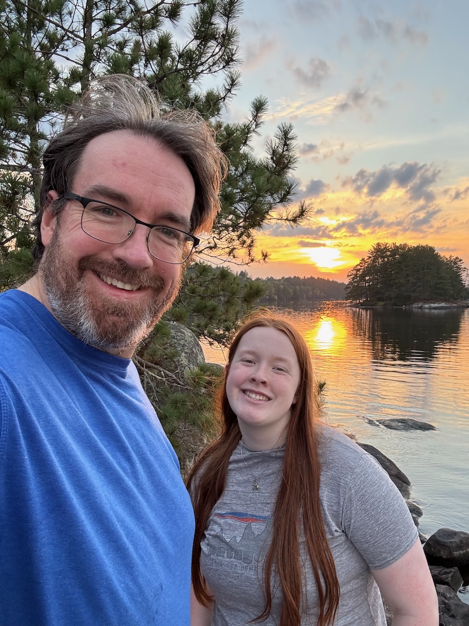 Chris and Cameron taking a selfie at the Ash River area during sunset.