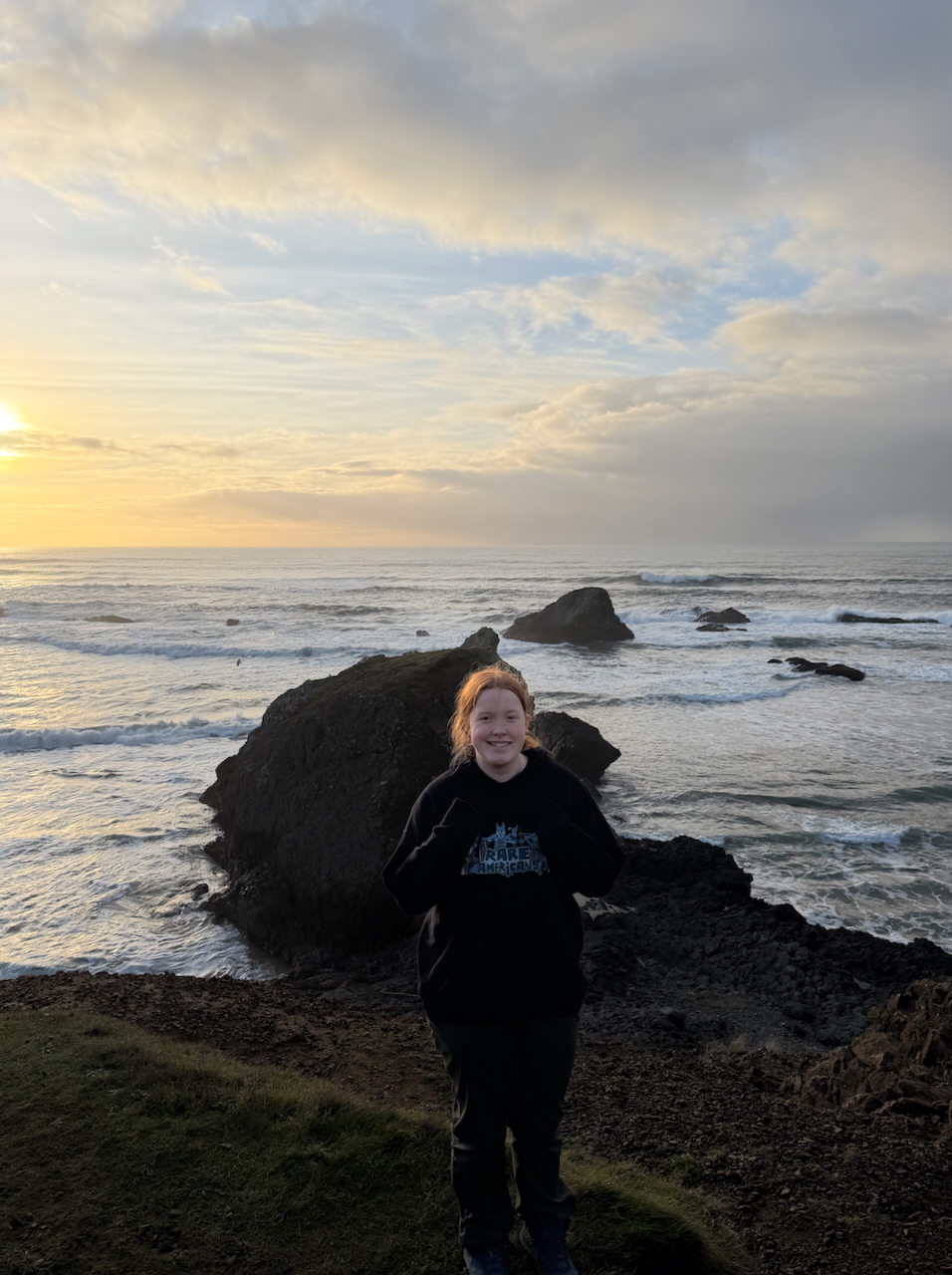Cameron standing at Seal Rock during sunset on the Oregon Coast