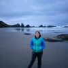 Cameron standing at Seal Rock before sunrise on the Oregon Coast