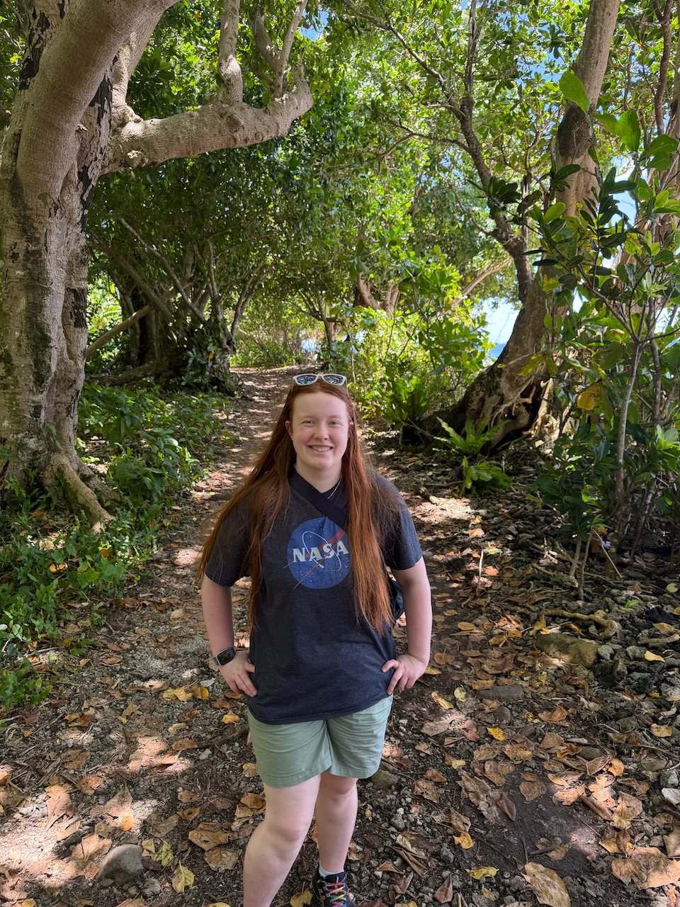 Cameron on a tropical forest trail in American Samoa.