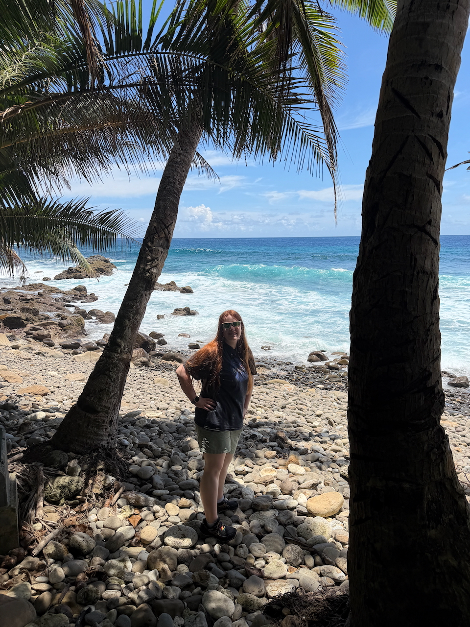 Cameron on a rocky beach in American Samoa.