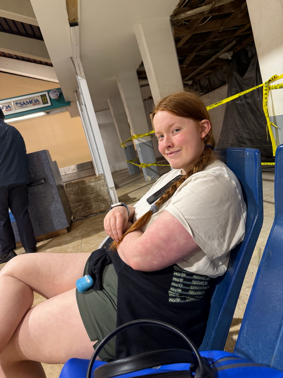 Cameron waiting outside at Pago Pago International Airport.
