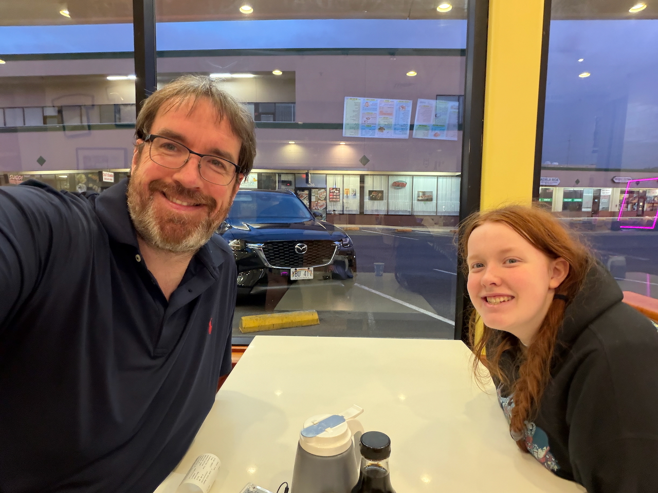 Chris and Cameron having breakfast near Honolulu Airport.