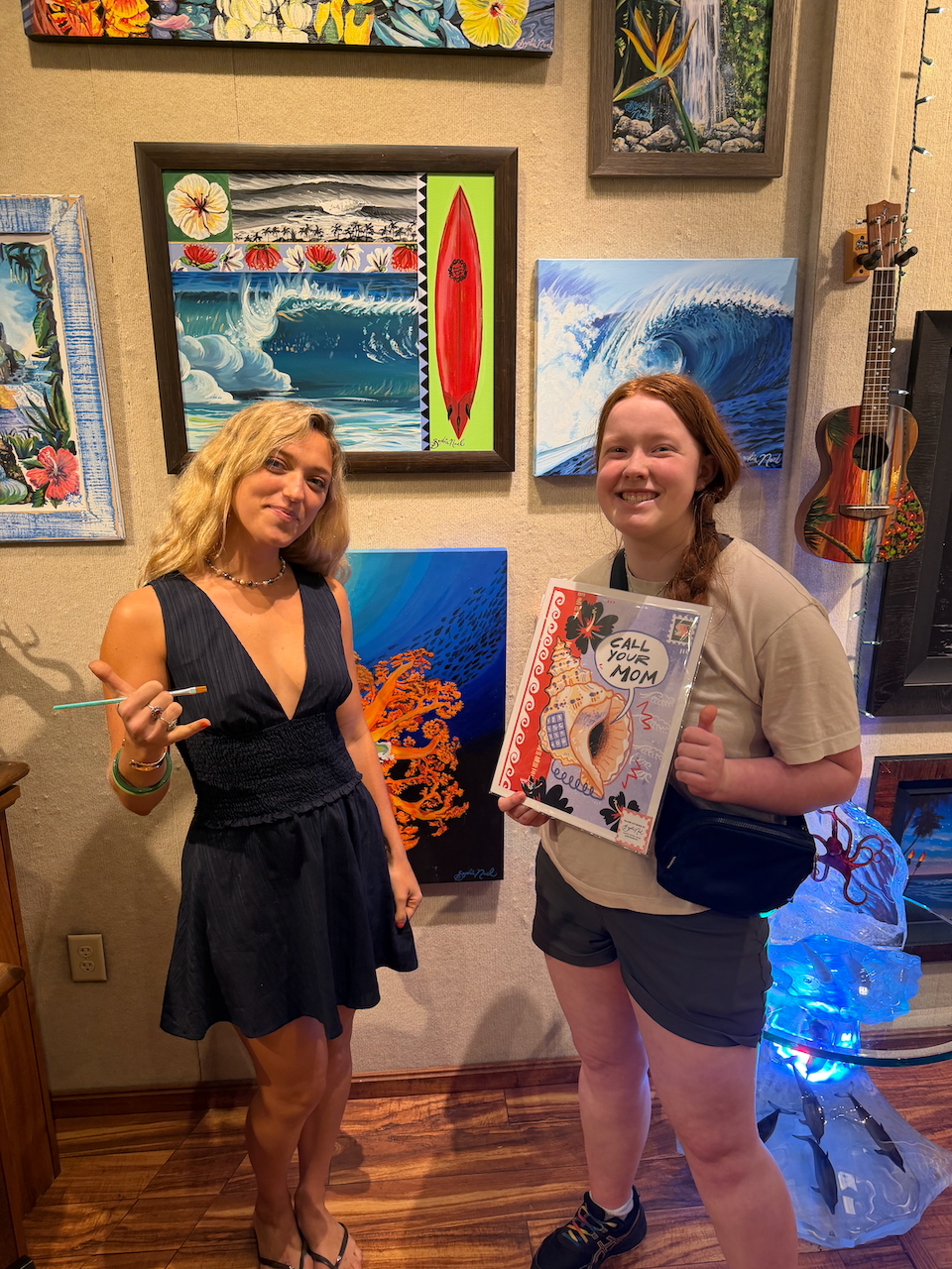 Cameron with a local artist at the Wyland Gallery in Waikiki.