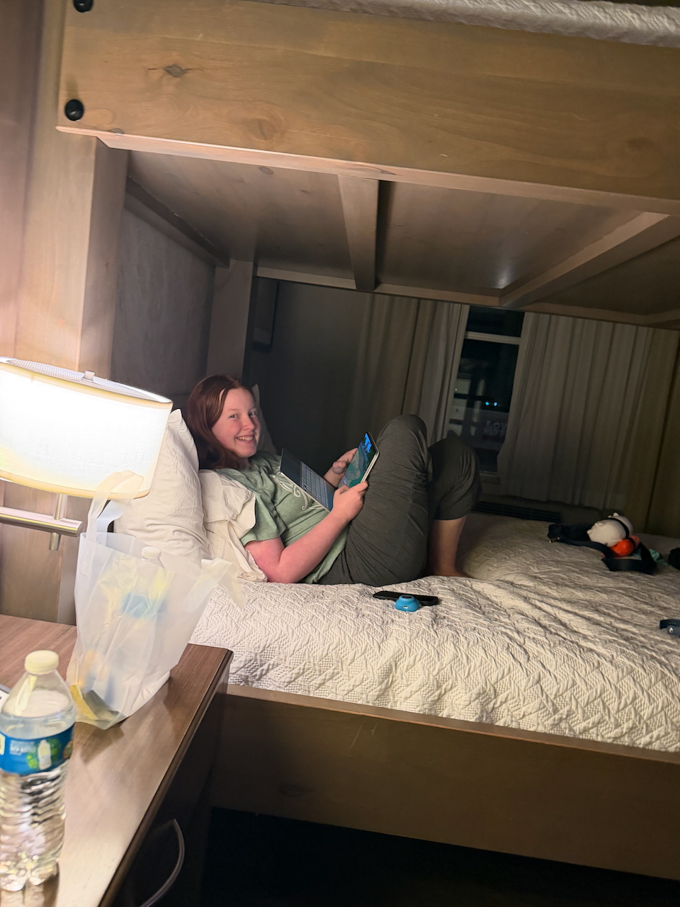 Cameron relaxing in our Hilton hotel room in Moab.
