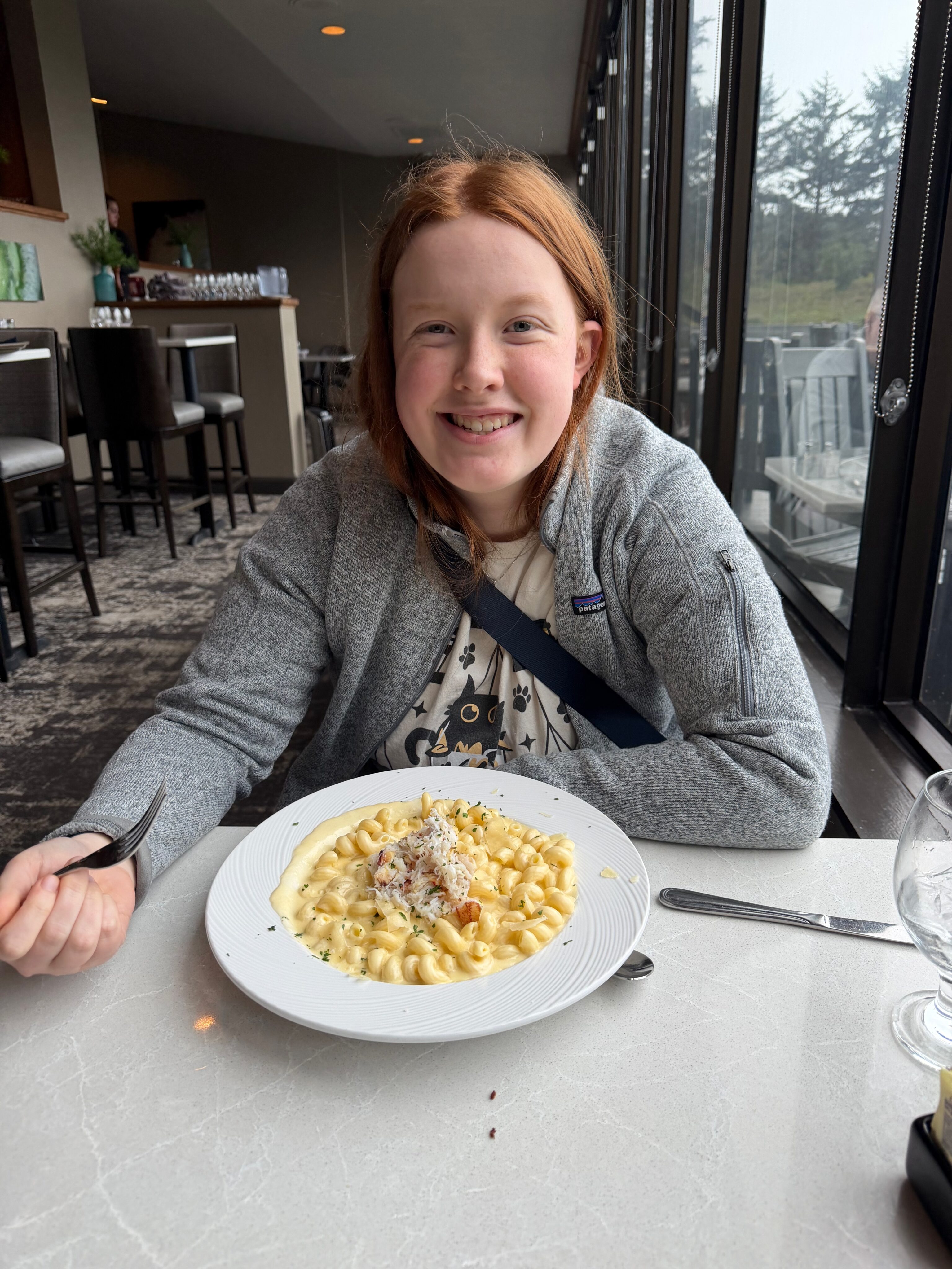 Cami eating dinner in Newport, Oregon.