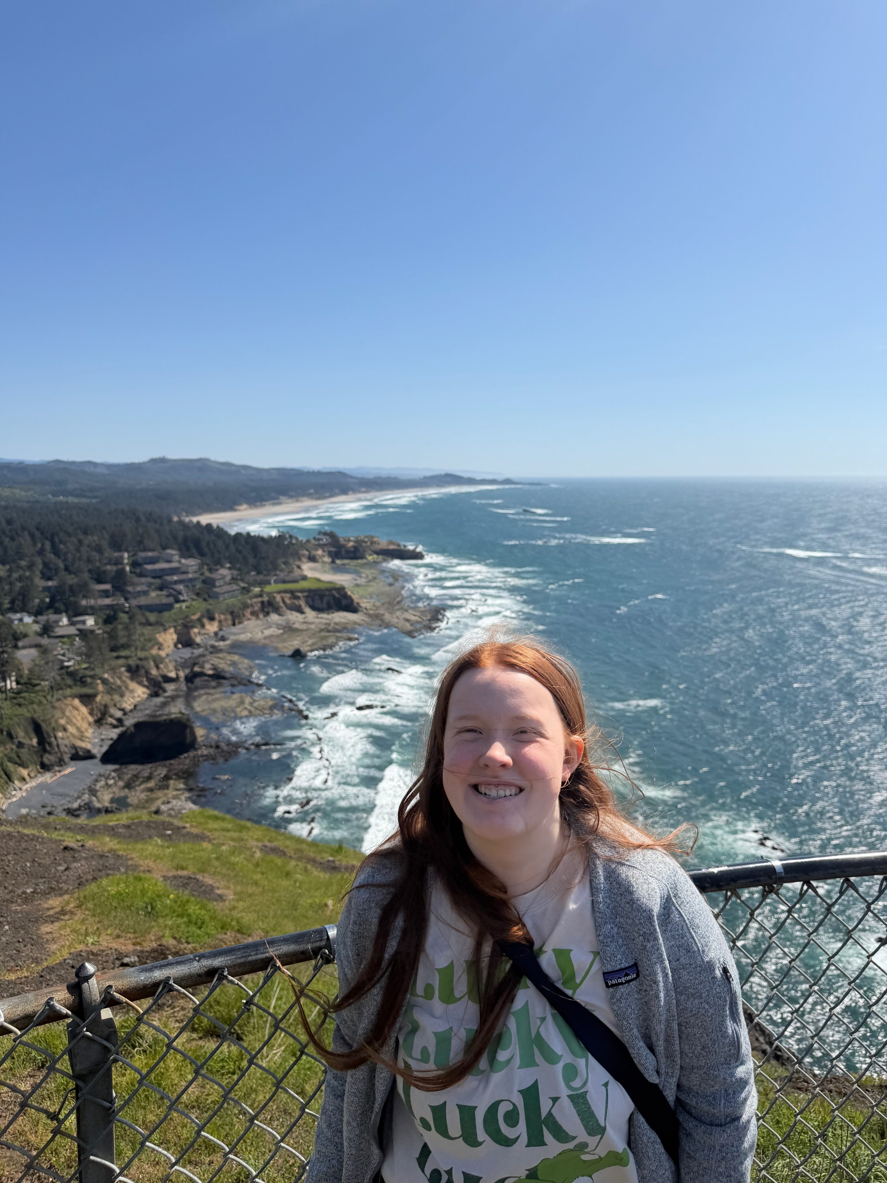Cami standing at an overlook on the Oregon Coast north of Newport.