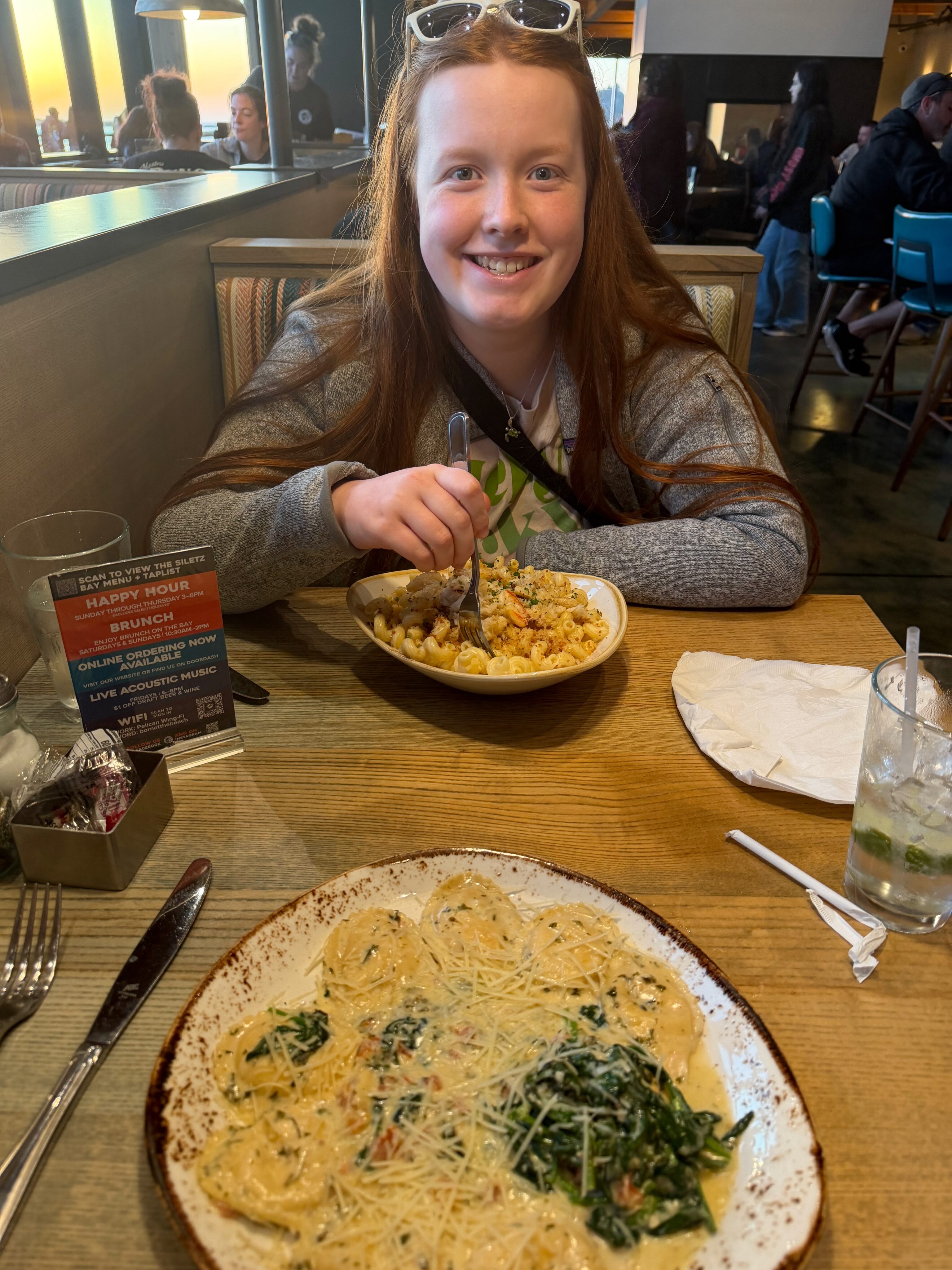 Cami eating dinner at Pelican Brewing on the Oregon Coast.
